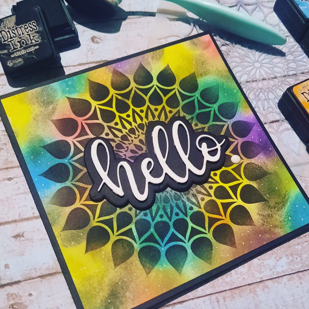 Colourful layered Hello Sentiment card with a mandala stencil.